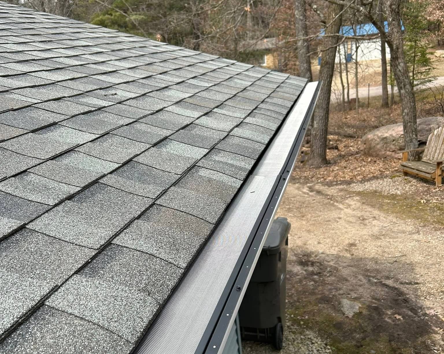 asphalt shingle roof installation with gutters